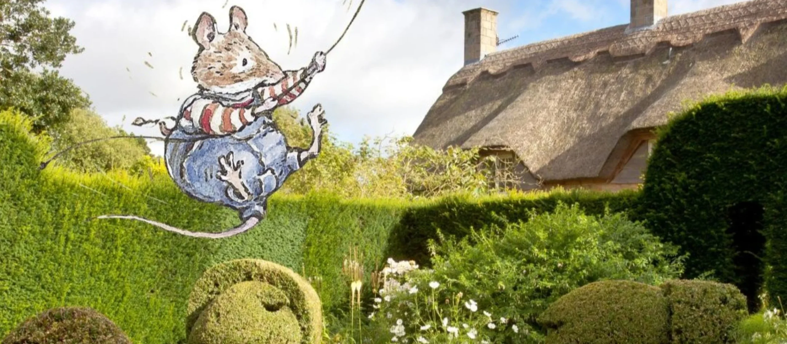Illustrated Brambly Hedge mouse character flying a kite over the hedges at Hidcote gardens
